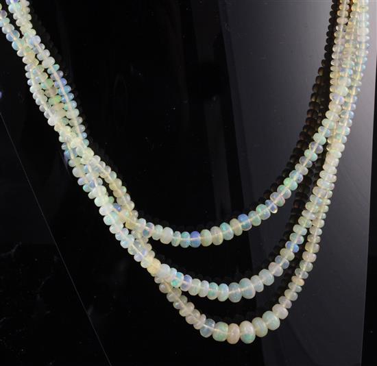 A 1960s triple strand graduated opal bead necklace, 16.5in.